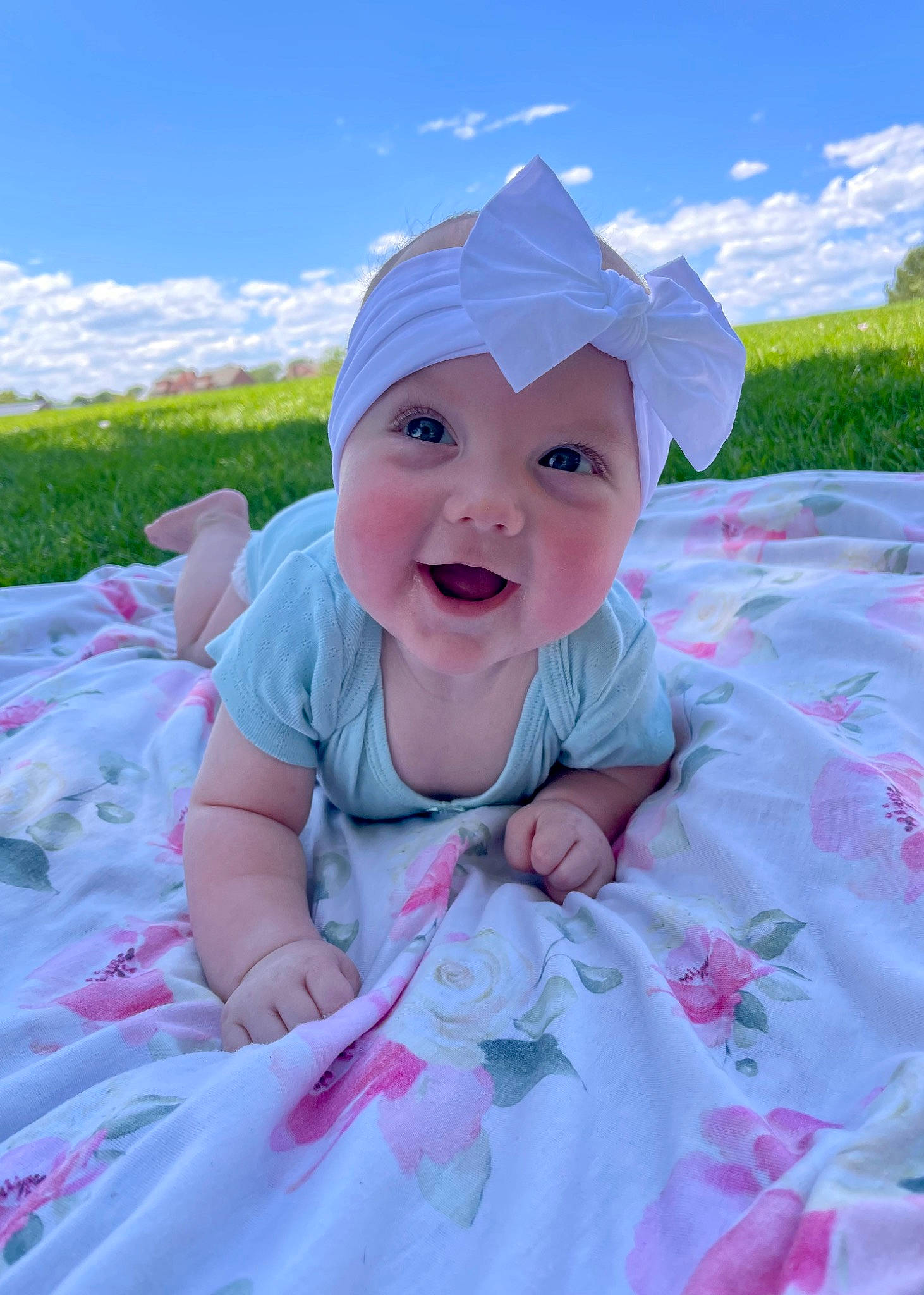 Laila is registered to the contest to win money with this photo: azure, baby, baby_toddler_clothing, child, cloud, facial_expression, fun, grass, happy, hat, headwear, leaf, leisure, people_in_nature, person, pink, plant, recreation, skin, sky