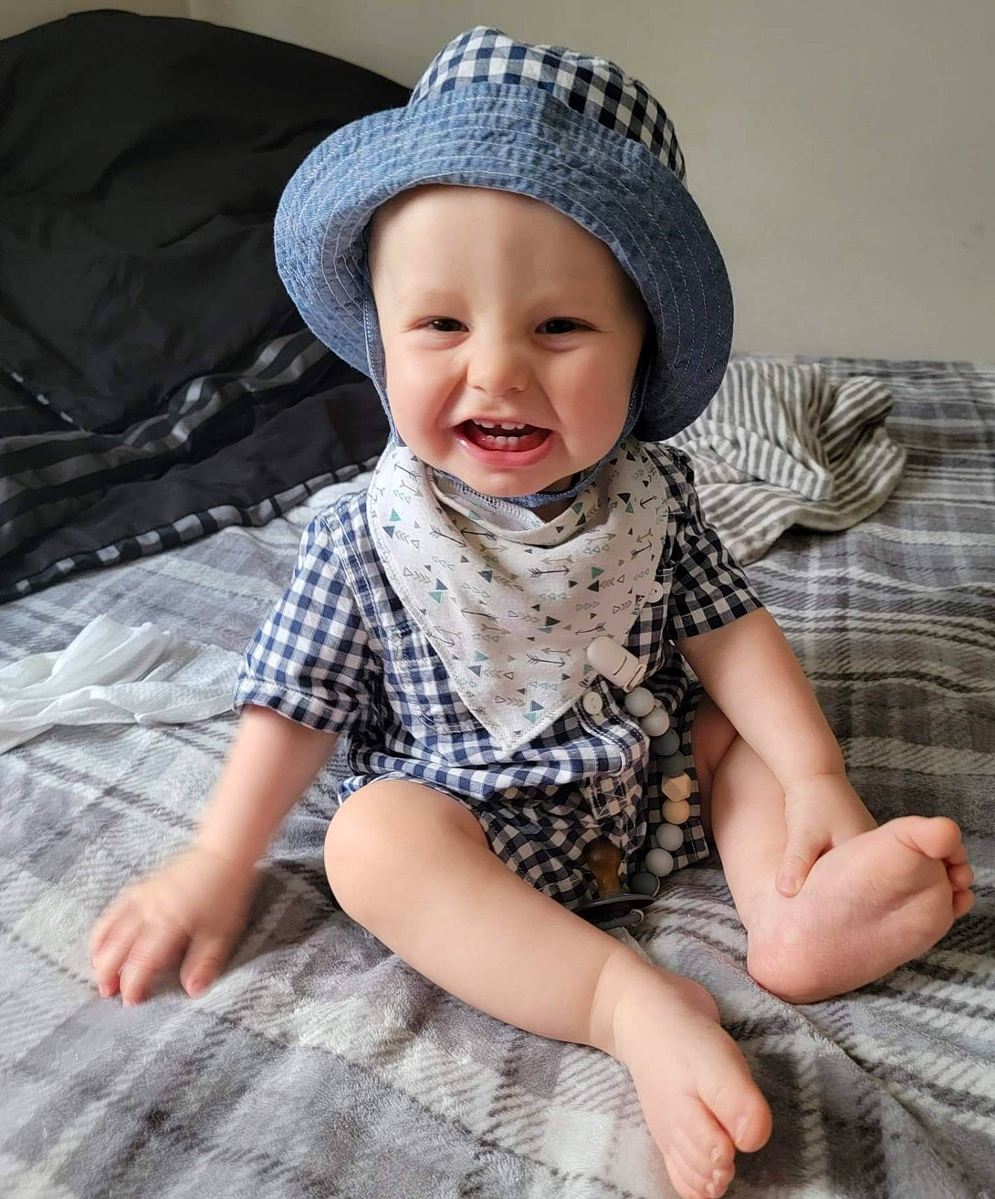 Aidyn joined the competition — help win amazing prizes! baby, baby_toddler_clothing, cap, child, collar, comfort, eye, face, flooring, happy, head, headwear, pattern, person, photograph, plaid, skin, sleeve, smile, sun_hat