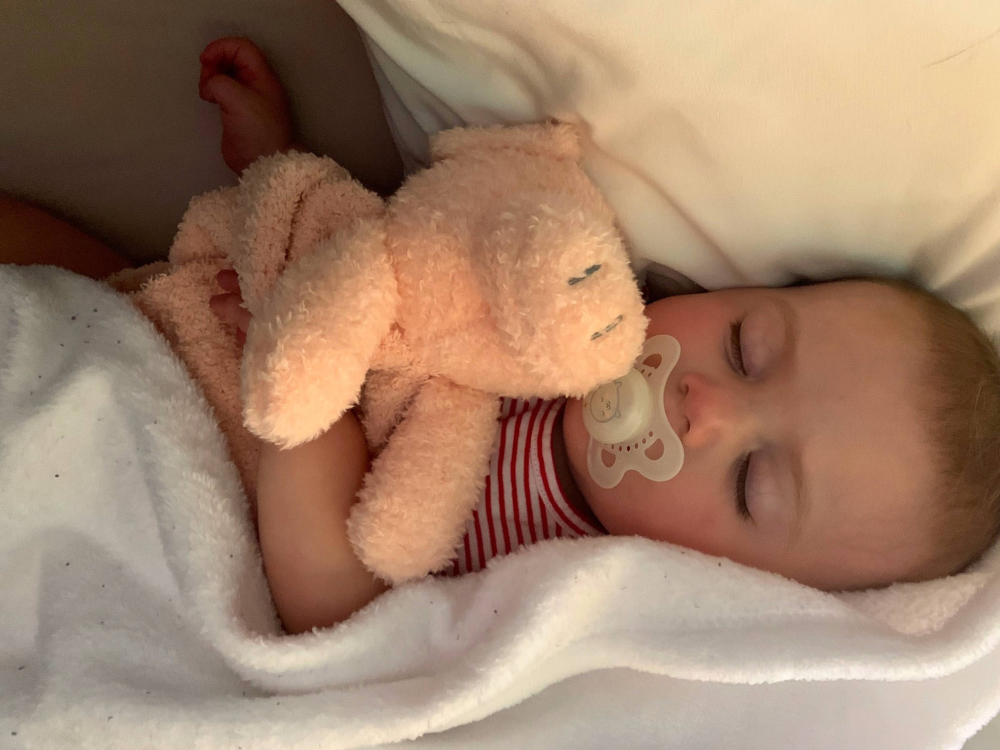 Kate is registered to the contest to win money with this photo: arm, baby_sleeping, baby_toddler_clothing, cheek, chin, comfort, ear, eye, facial_expression, gesture, hand, human_body, iris, lip, mammal, mouth, nose, person, skin, textile