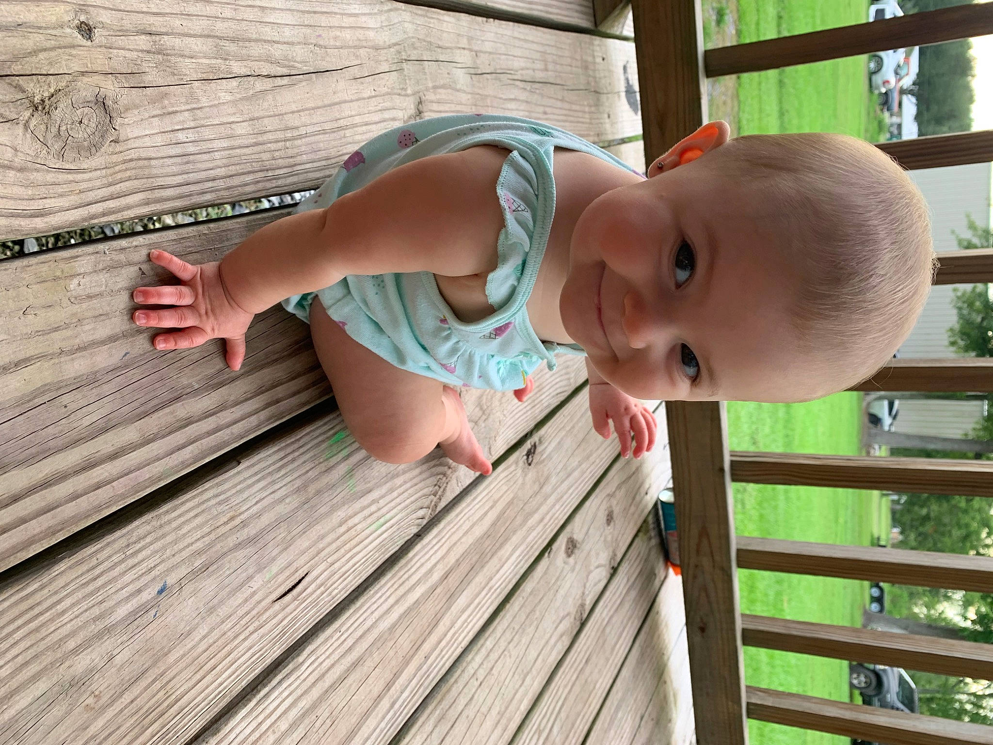 Kate is registered to the contest to win money with this photo: baby_toddler_clothing, dress, finger, flooring, fun, glasses, grass, hand, happy, hardwood, house, joy, leisure, person, plant, skin, smile, toddler, tree, window