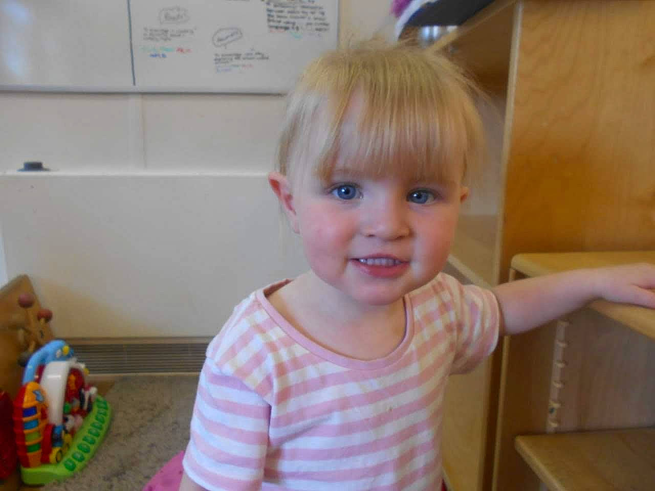 Ayanna joined the competition — help win amazing prizes! baby, blond, cheek, child, ear, eye, hair, iris, joy, person, play, room, skin, smile, standing, toddler, toy