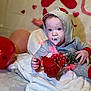 baby, pacifier, hoodie, red_rose, bouquet, blanket, balloon, heart, indoors, child, cute, soft, celebration, festive, portrait, clothing, flower, infant, decor, laying
