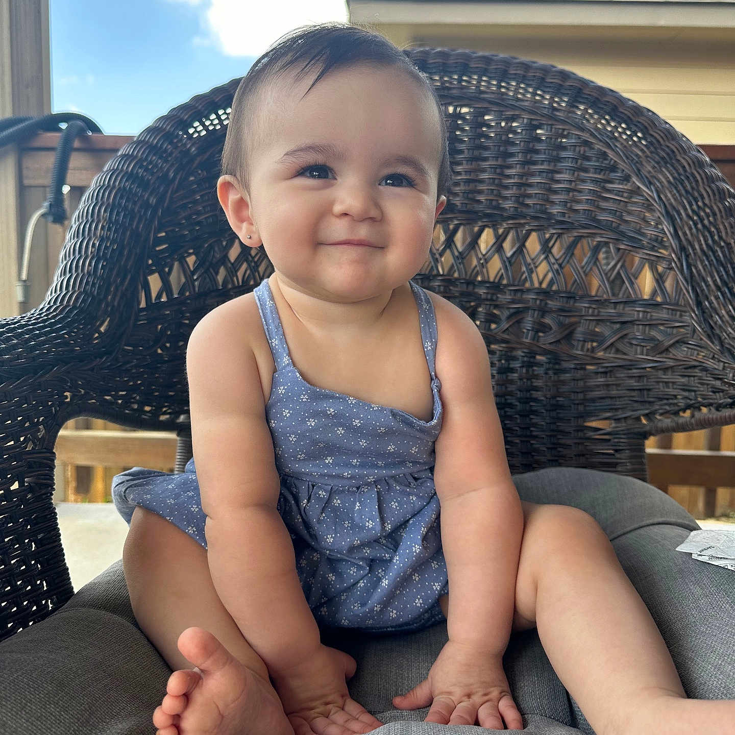 Malia is registered to the contest to win money with this photo: baby, chair, clothing, couch, cushion, dress, face, furniture, happy, head, homedecor, outdoors, pants, person, photography, portrait, shorts, sitting, smile, swimwear