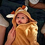Bruno a rejoint le concours — aidez-le/la à gagner de superbes lots ! baby, blanket, child, comfort, cozy, cute, deer_costume, expression, hand, hooded_towel, indoors, infant, legs, person, portrait, resting, socks, soft_texture, toddler, warm