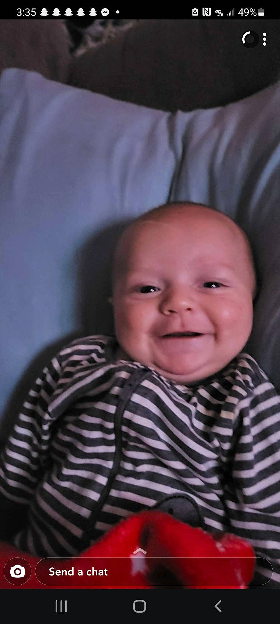 Carl is registered to the contest to win money with this photo: baby, baby_toddler_clothing, cheek, child, chin, comfort, eye, eyebrow, happy, iris, joy, linens, lip, mouth, nose, pattern, person, sitting, skin, sleeve