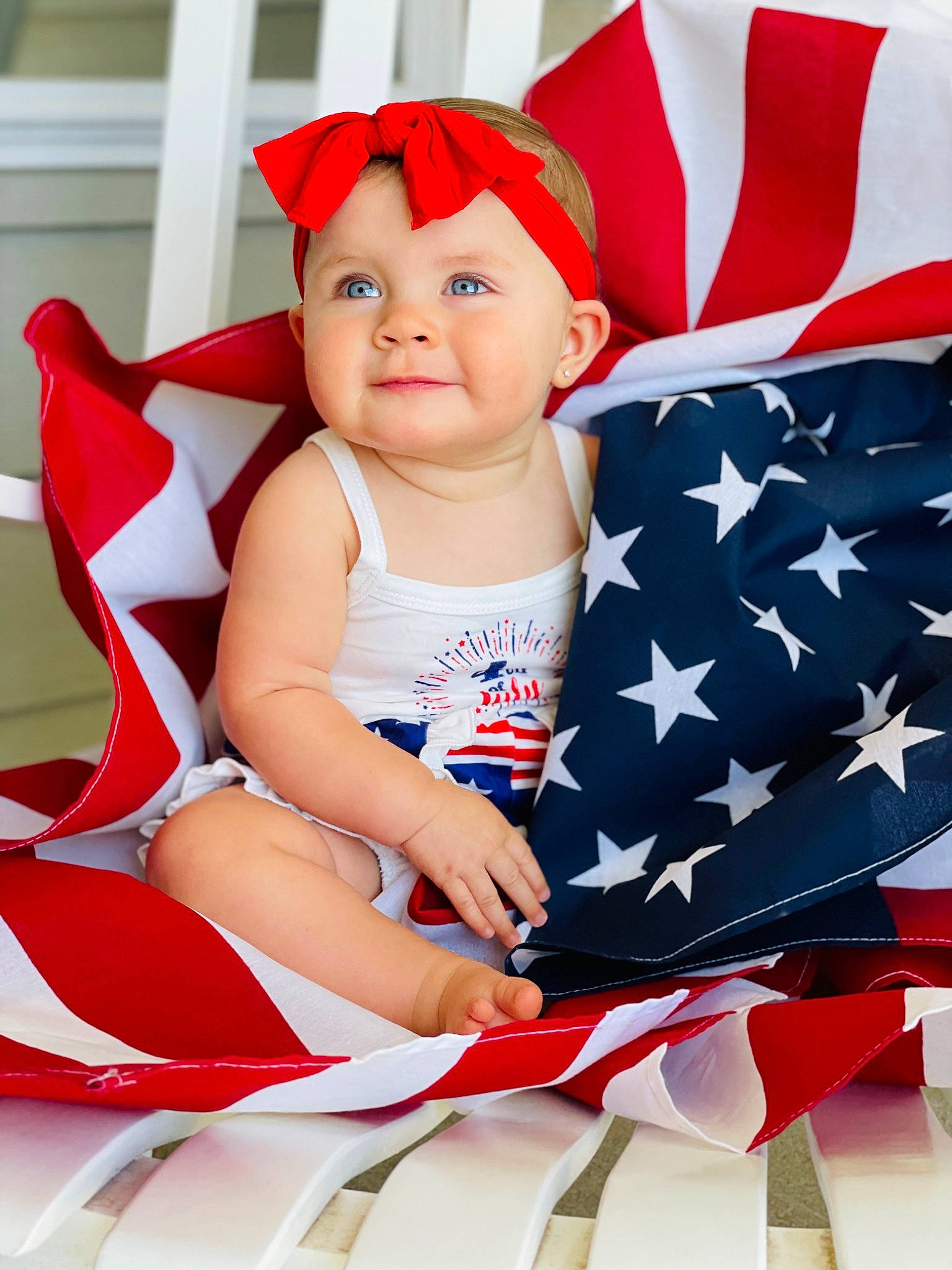 Kynslee is registered to the contest to win money with this photo: baby, baby_toddler_clothing, carmine, child, event, face, fictional_character, flag_day_usa, flag_of_the_united_states, fun, gesture, happy, hat, headwear, holiday, joy, person, product, red, sitting