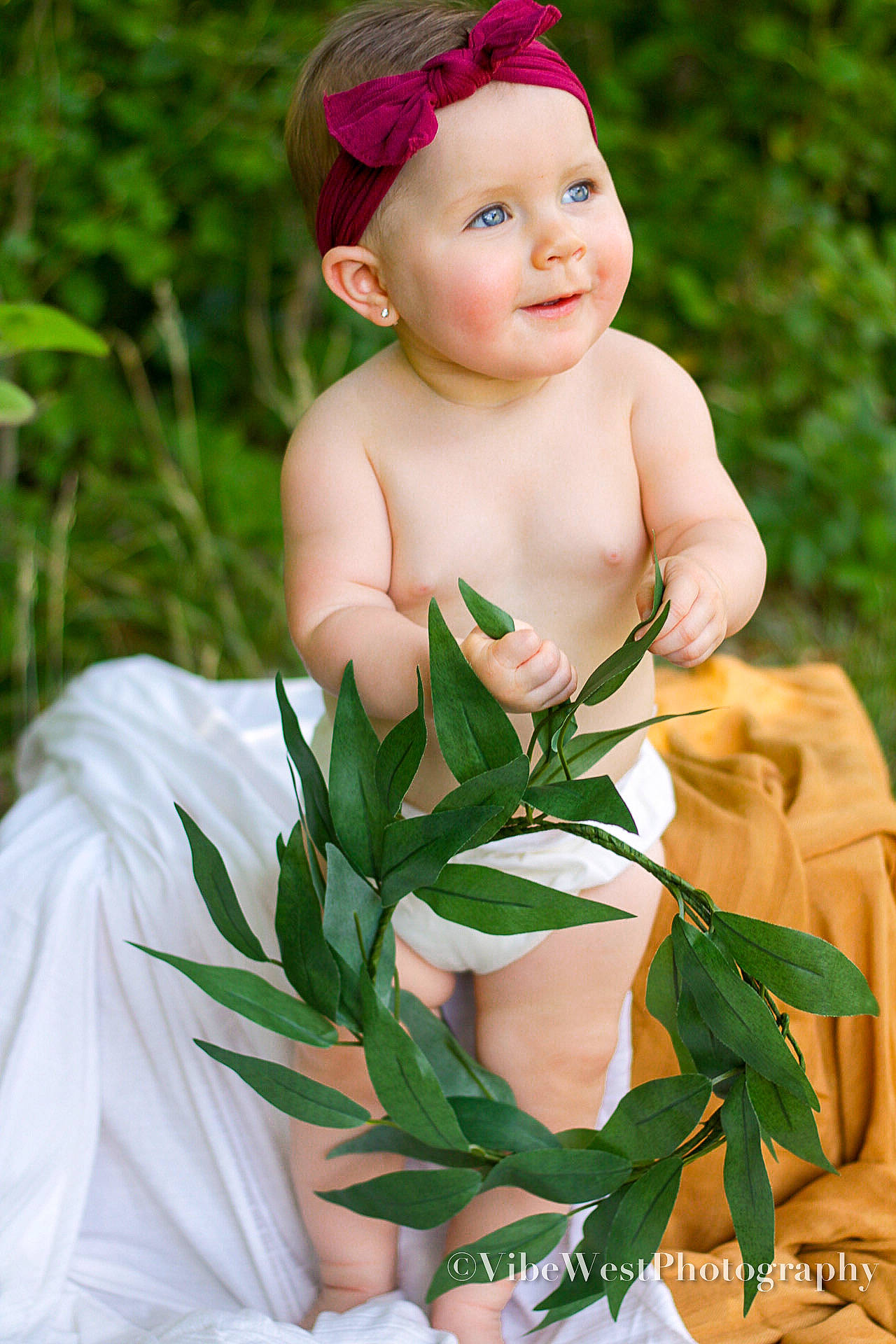 Kynslee is registered to the contest to win money with this photo: baby, baby_toddler_clothing, botany, cap, chest, eye, face, grass, happy, head, headwear, human_body, joy, lip, people_in_nature, person, photograph, plant, skin, smile