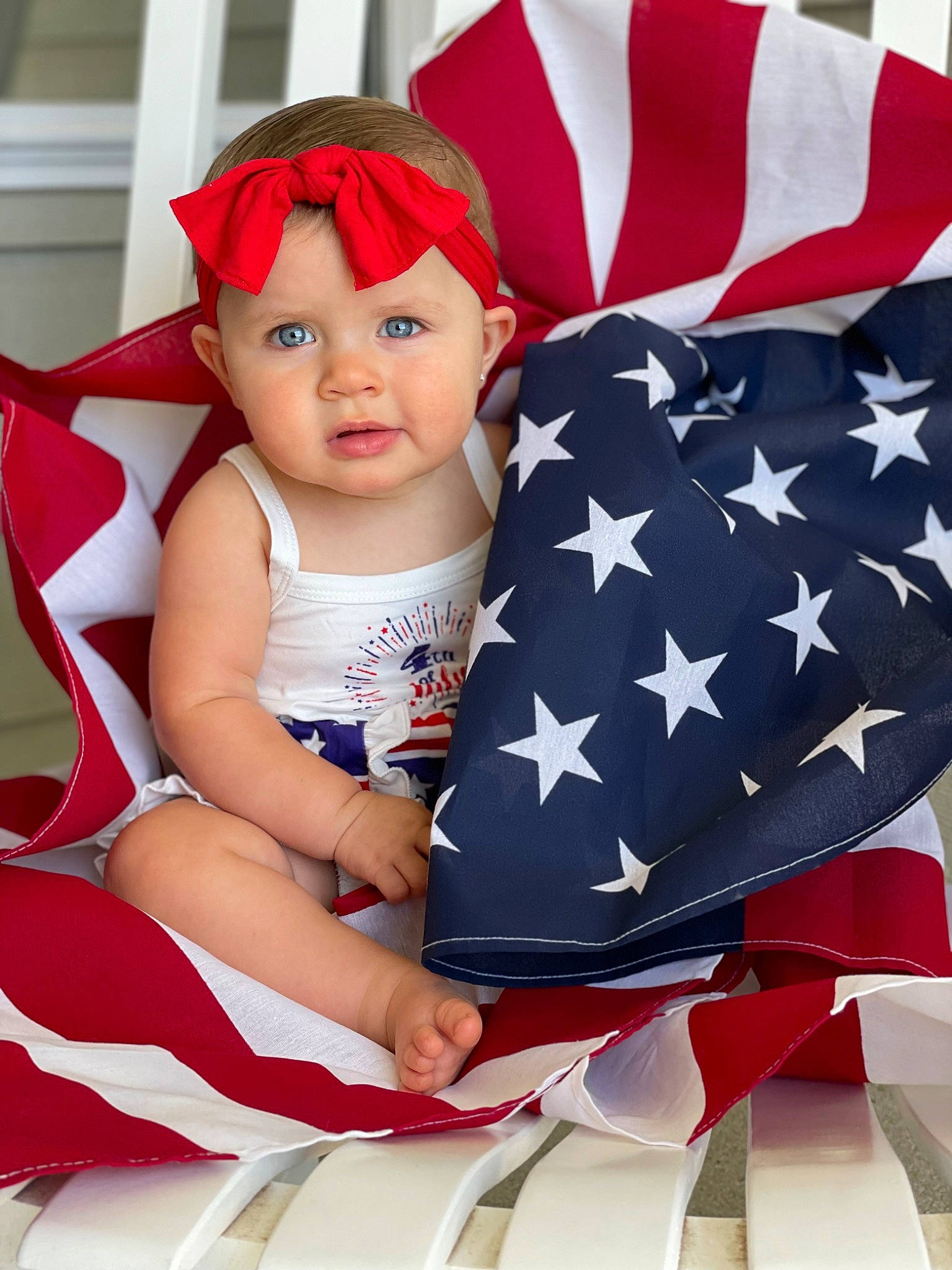 Kynslee joined the competition — help win amazing prizes! arm, baby, baby_toddler_clothing, chair, child, clothing, electric_blue, event, face, flag, flag_day_usa, flag_of_the_united_states, gesture, hand, happy, headwear, holiday, person, red, sleeve
