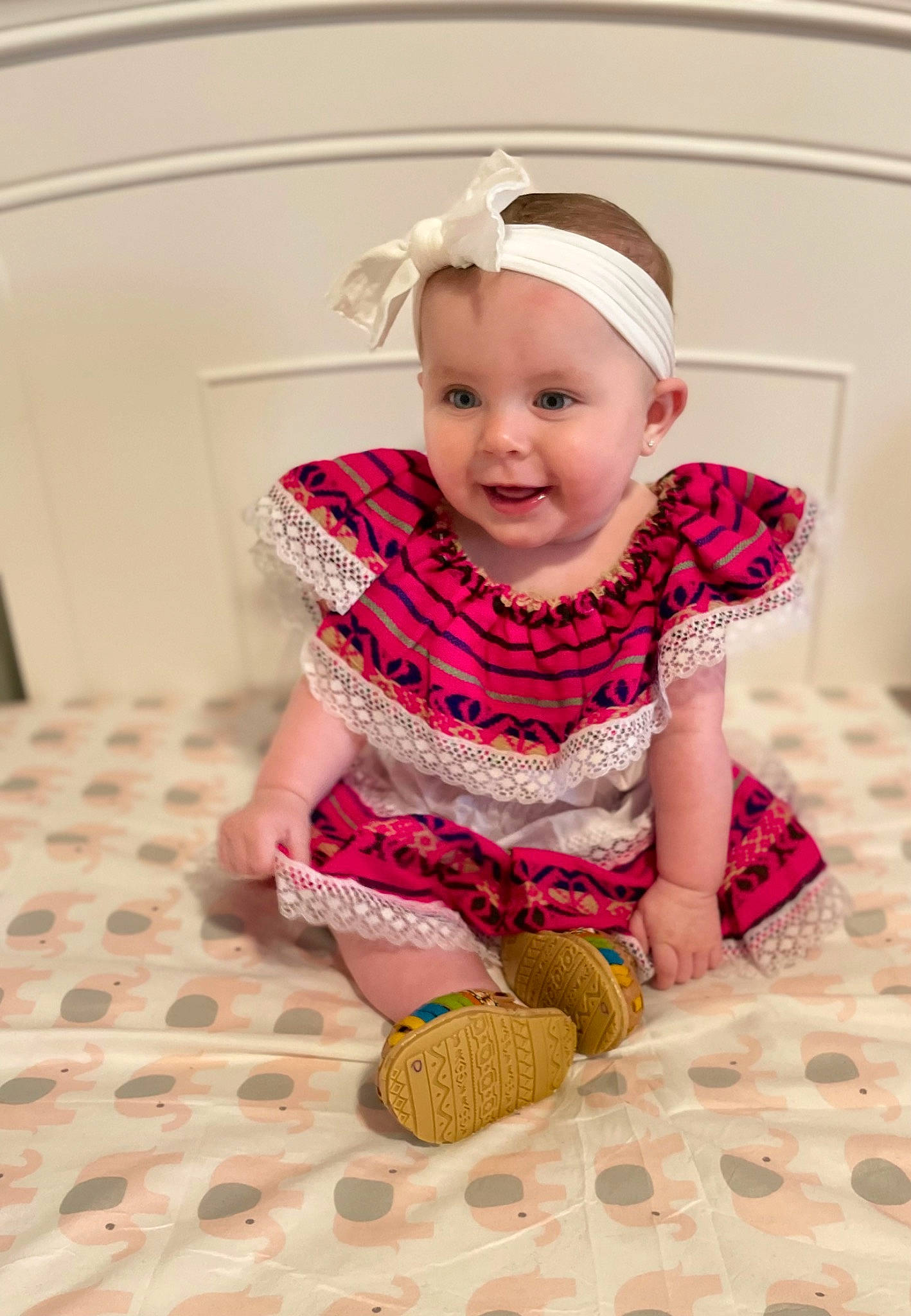 Kynslee joined the competition — help win amazing prizes! arm, baby, baby_toddler_clothing, cap, child, clothing, dress, face, floor, flooring, happy, headwear, human_leg, magenta, pattern, person, pink, skin, sleeve, smile