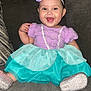 baby, child, smiling, dress, headband, starfish, purple, teal, couch, happy, sitting, footwear, indoor, cute, person, portrait, clothing, toddler, accessory, home