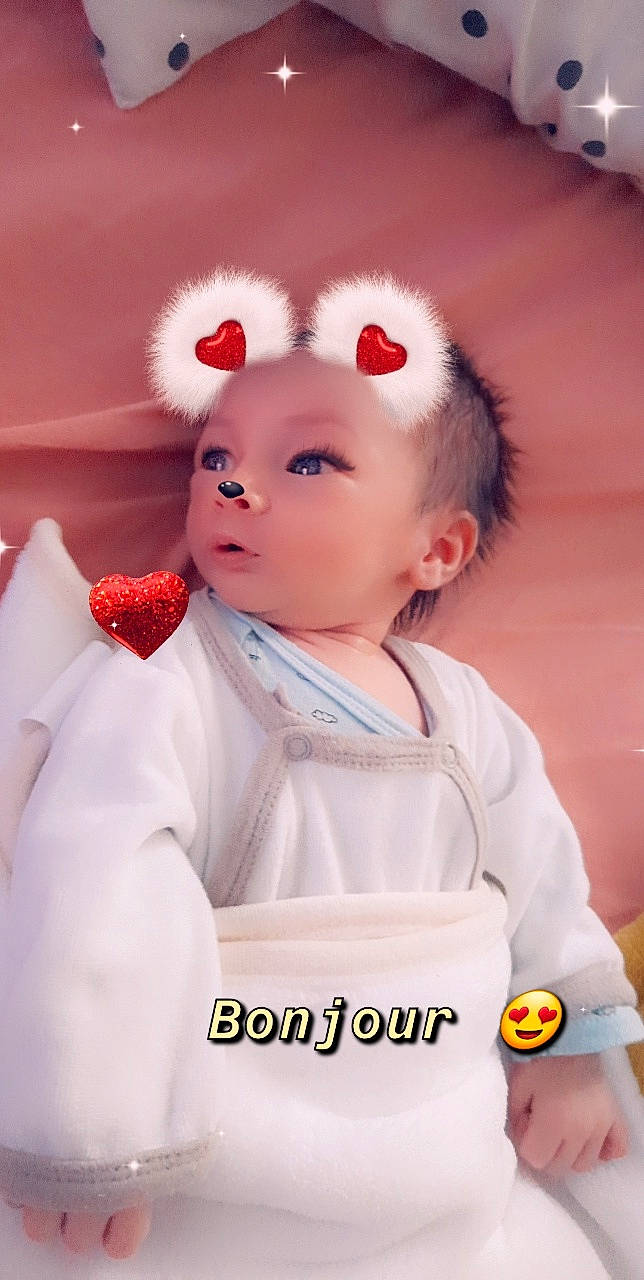 Sacha a rejoint le concours — aidez-le/la à gagner de superbes lots ! baby, baby_products, baby_toddler_clothing, cheek, child, costume, doll, eyelash, face, fashion_accessory, formal_wear, fur, happy, head, headband, peach, person, pink, sleeve, toddler