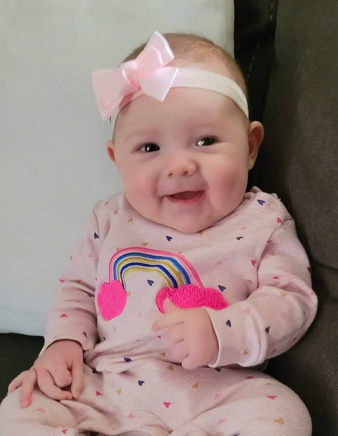 Breanna is registered to the contest to win money with this photo: baby, baby_toddler_clothing, cheek, child, comfort, dress, eye, face, happy, head, headgear, headwear, joy, person, pink, product, skin, sleeve, smile, stomach