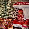 baby, child, infant, christmas, holiday, santa_hat, christmas_tree, presents, gift_wrapping, festive, portrait, smiling, sitting, red_clothing, indoor, fireplace, stocking, decorations, celebration, photography