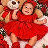 Adriana is registered to the contest to win money with this photo: baby, baby_shoes, bouquet, celebration, child, close_up, colorful, floral_background, flowers, hair_bow, happy, indoor, infant, lying_down, portrait, red_dress, roses, sitting, smiling, teddy_bear