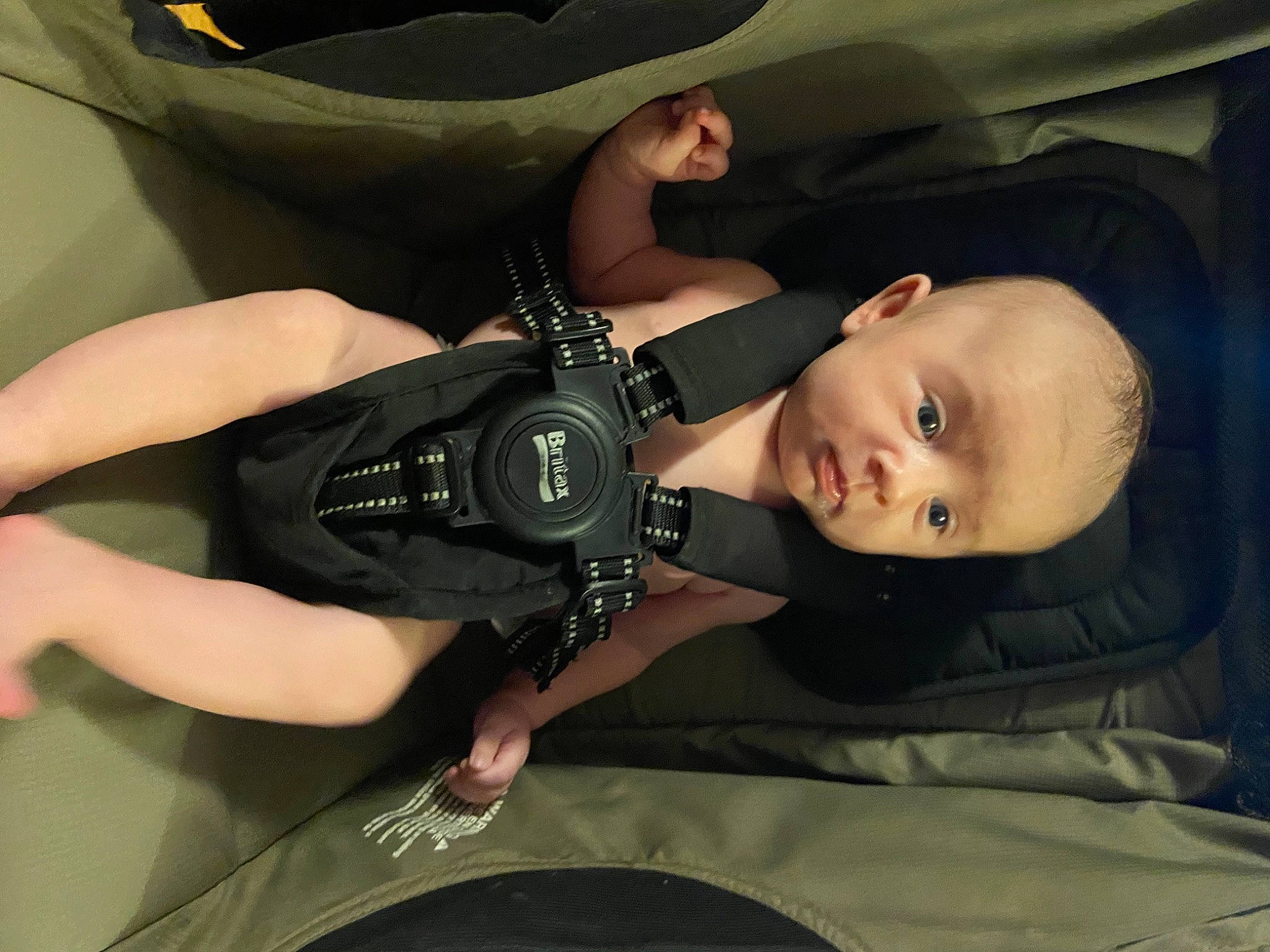 Prince is registered to the contest to win money with this photo: auto_part, automotive_design, automotive_exterior, automotive_tire, automotive_wheel_system, baby, baby_carriage, bumper, car_seat, child, comfort, finger, flash_photography, motor_vehicle, person, sitting, smile, thumb, toddler, vehicle_door