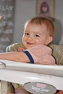 Kenny is registered to the contest to win money with this photo: baby, baby_products, baby_safety, baby_toddler_clothing, blond, cheek, child, comfort, eyelash, face, fun, happy, iris, joy, laugh, person, room, sitting, skin, smile