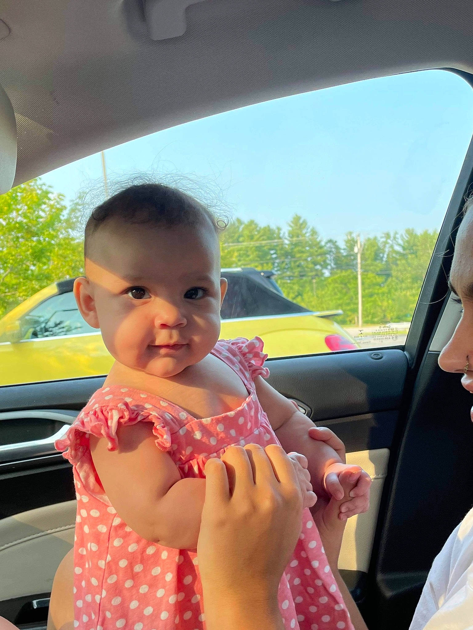 Karmella is registered to the contest to win money with this photo: automotive_design, automotive_exterior, automotive_mirror, baby_toddler_clothing, car, car_seat, cool, facial_expression, finger, fun, gesture, hairstyle, happy, motor_vehicle, mouth, person, skin, sky, thumb, toddler