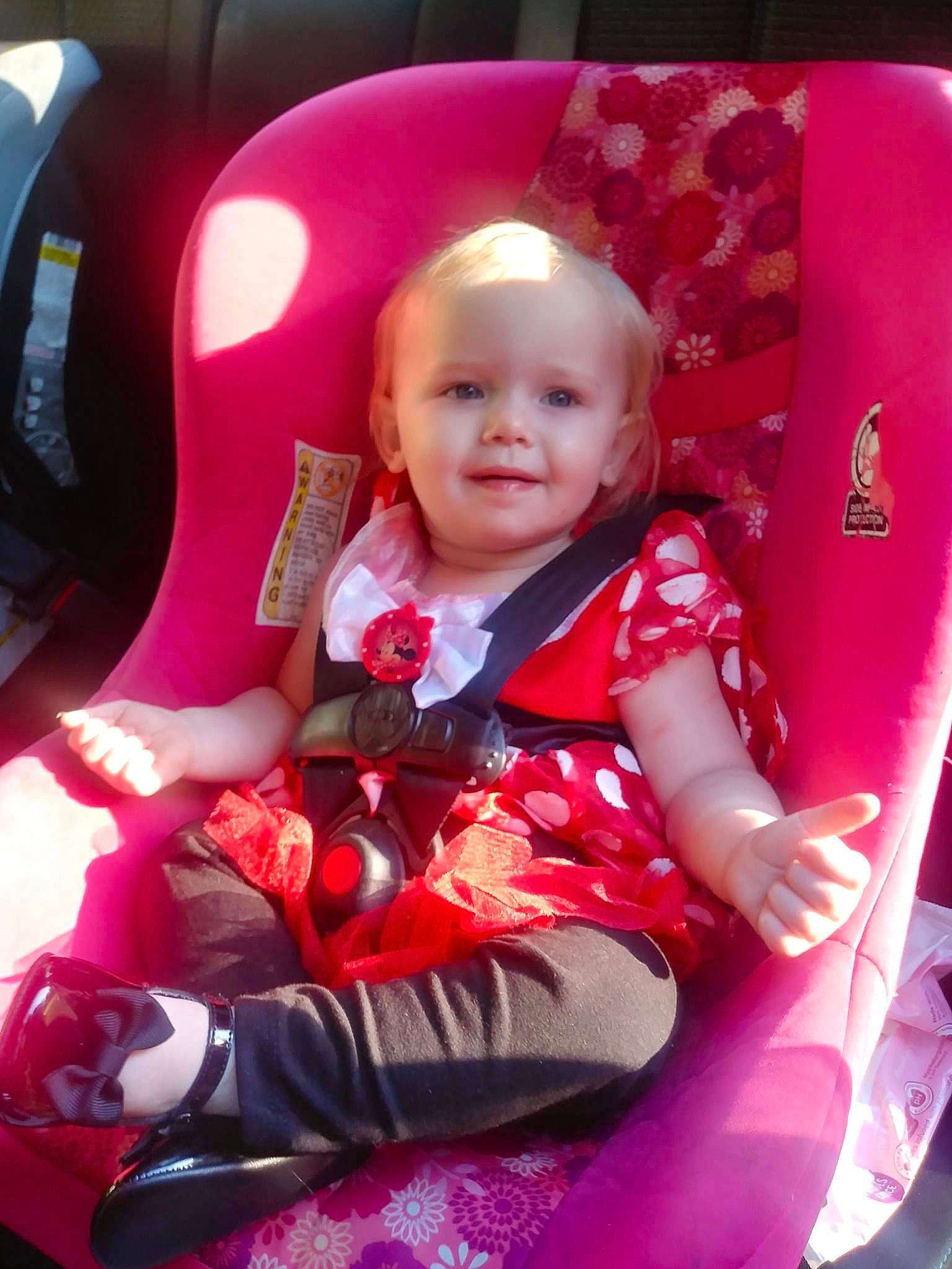 Gabriella joined the competition — help win amazing prizes! auto_part, baby, baby_products, baby_toddler_clothing, car_seat, car_seat_cover, carmine, child, comfort, fun, lap, magenta, motor_vehicle, person, pink, product, sitting, smile, steering_wheel, toddler