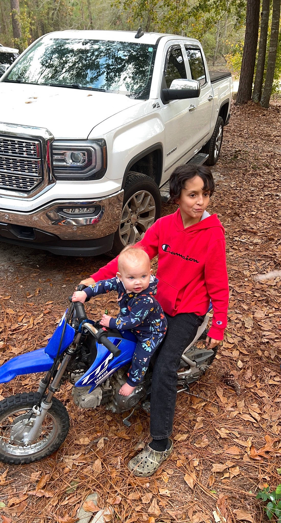 Kyler is registered to the contest to win money with this photo: auto_part, automotive_design, automotive_exterior, automotive_lighting, automotive_tire, automotive_wheel_system, bumper, car, fender, grille, hood, land_vehicle, landscape, motor_vehicle, person, plant, rim, tire, truck, vehicle