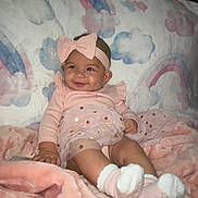 Alaiyah joined the competition — help win amazing prizes! baby, blanket, bow, child, clouds, cozy, cute, happy, headband, indoors, infant, pink_clothing, portrait, rainbow, seated, smiling, socks, soft_texture, tutu_skirt, warm