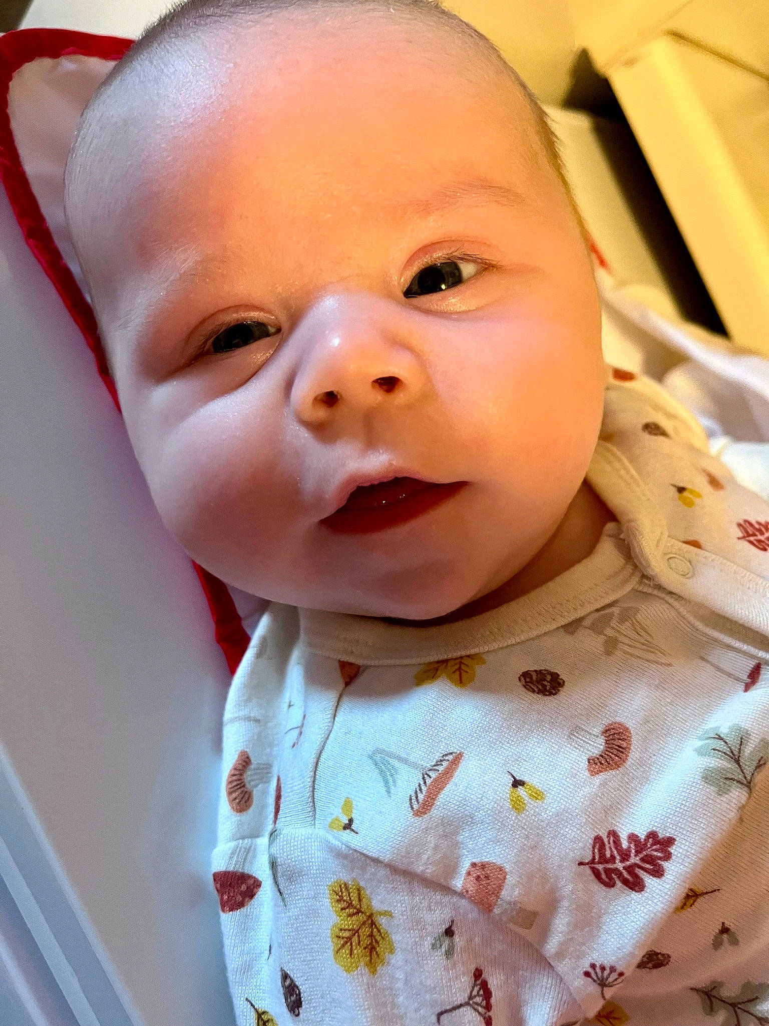 Nicolas is registered to the contest to win money with this photo: baby, baby_laughing, baby_products, baby_toddler_clothing, cheek, child, collar, eyelash, facial_expression, happy, lip, mouth, nose, pattern, person, pink, product, skin, sleeve, smile