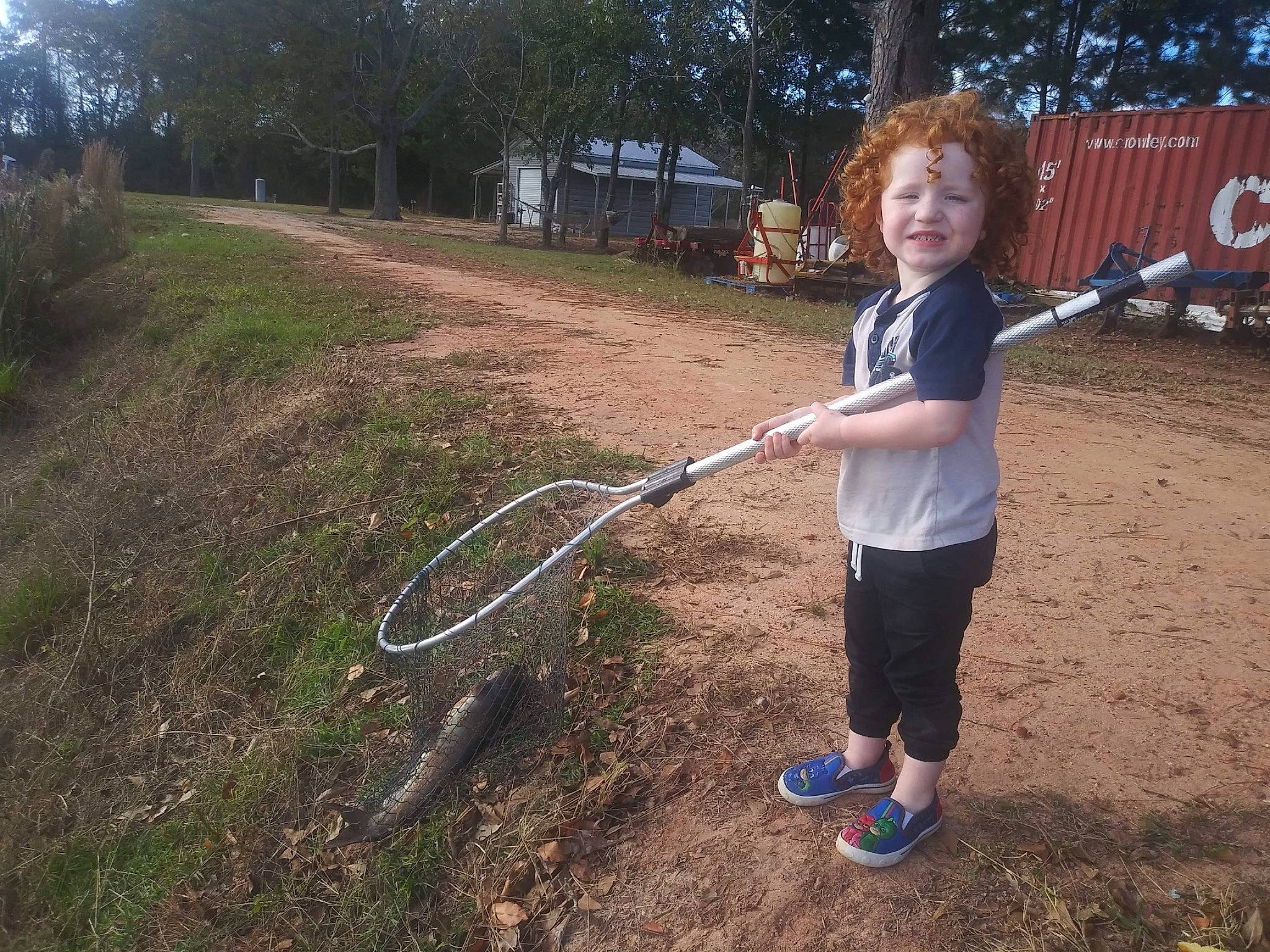 Christian is registered to the contest to win money with this photo: child, city, fun, garden_tool, grass, hoop_rhythmic_gymnastics, hose, joy, leisure, people_in_nature, person, plant, play, recreation, smile, soil, sports_toy, t_shirt, toddler, tree