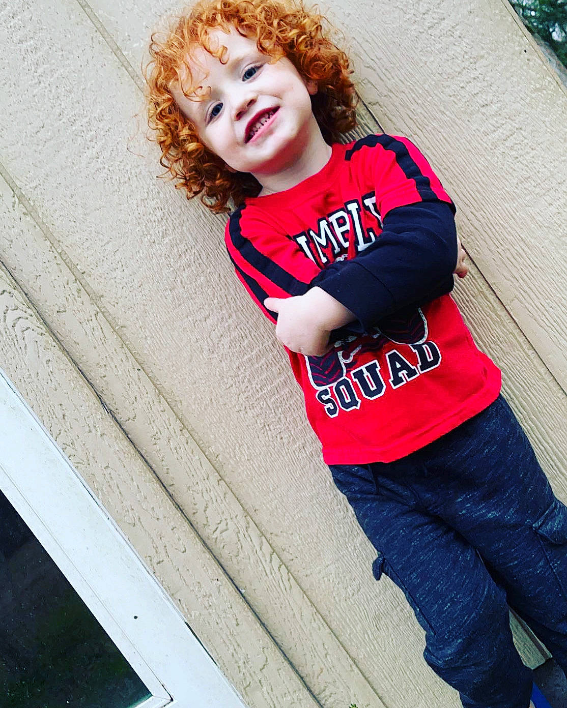 Christian is registered to the contest to win money with this photo: blond, brown_hair, child, clothing, denim, electric_blue, face, fun, happy, human_leg, jersey, joy, leisure, magenta, person, sleeve, smile, sportswear, street_fashion, t_shirt