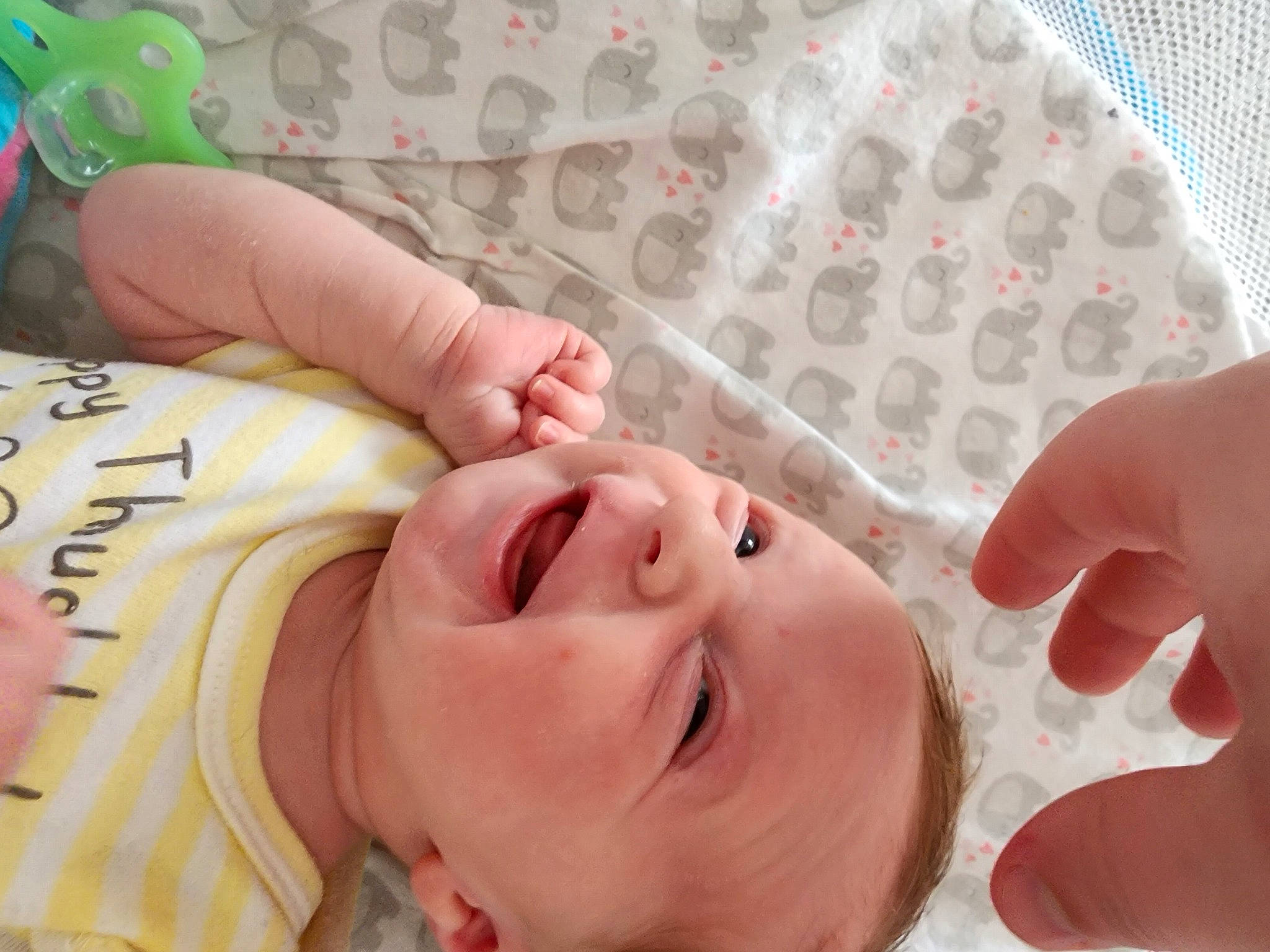 Lilly is registered to the contest to win money with this photo: baby, baby_toddler_clothing, cheek, child, chin, ear, eyelash, face, finger, gesture, happy, lip, mouth, nail, nose, person, skin, smile, throat, thumb