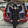 Isabella joined the competition — help win amazing prizes! child, halloween, costume, black_dress, braids, portrait, standing, car, trunk, decorated_car, spooky, garland, skulls, ghosts, pumpkins, parking_lot, outdoor, autumn, gothic, full_body