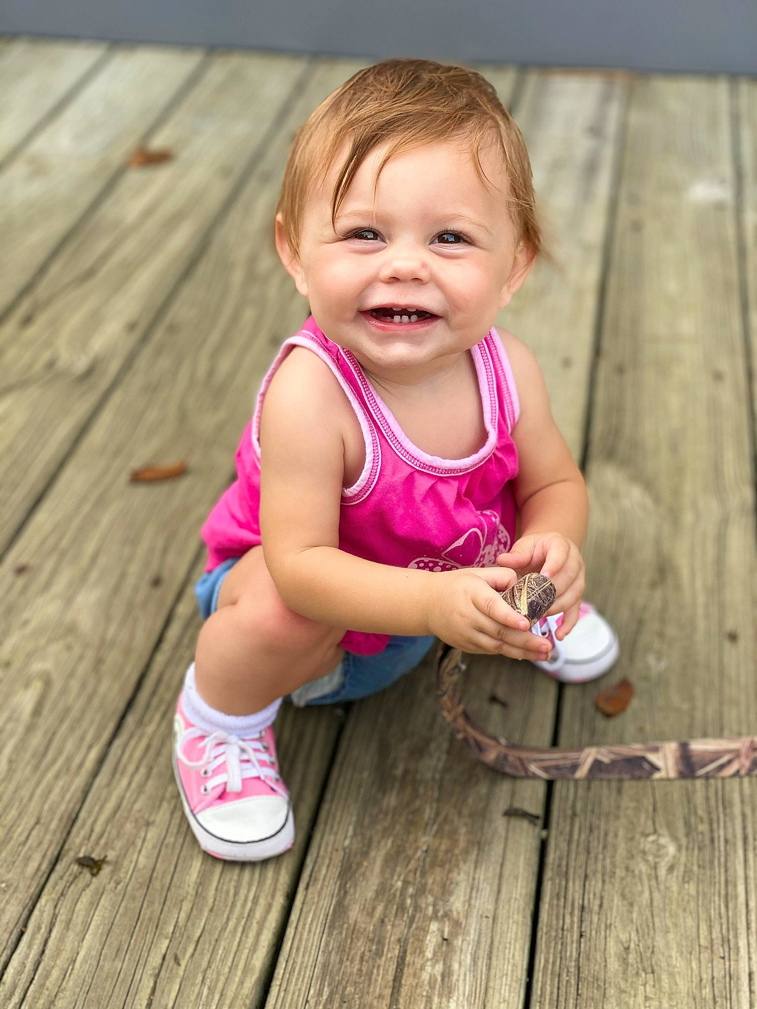 Laylah is registered to the contest to win money with this photo: active_tank, baby, baby_toddler_clothing, blond, cheek, child, eye, finger, happy, hardwood, joy, person, pink, plank, shoe, skin, thumb, toddler, walking_shoe, wood
