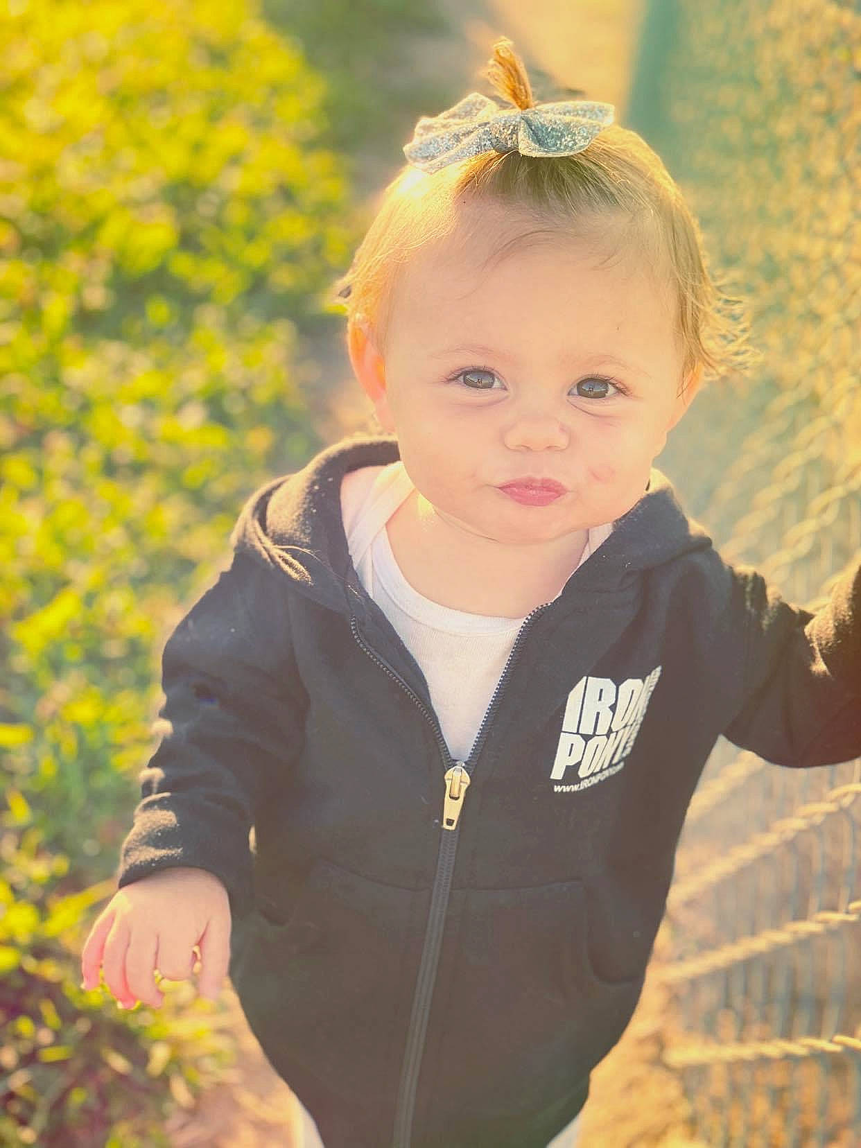 Laylah joined the competition — help win amazing prizes! arm, baby, baby_toddler_clothing, blond, brown_hair, cheek, child, child_model, facial_expression, finger, hair_accessory, happy, headband, headpiece, jacket, people_in_nature, person, portrait_photography, sleeve, thumb