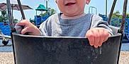 Tallulah is registered to the contest to win money with this photo: baby, child, swing, playground, outdoor, smile, happy, sky, sunny, clothing, seat, hand, legs, play, fun, daytime, person, park, umbrella, equipment