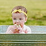 baby, child, lemon, metal_tub, yellow_bow, headband, outdoor, grass, summer, cute, curious, water, skin, face, hands, expression, nature, greenery, infant, portrait