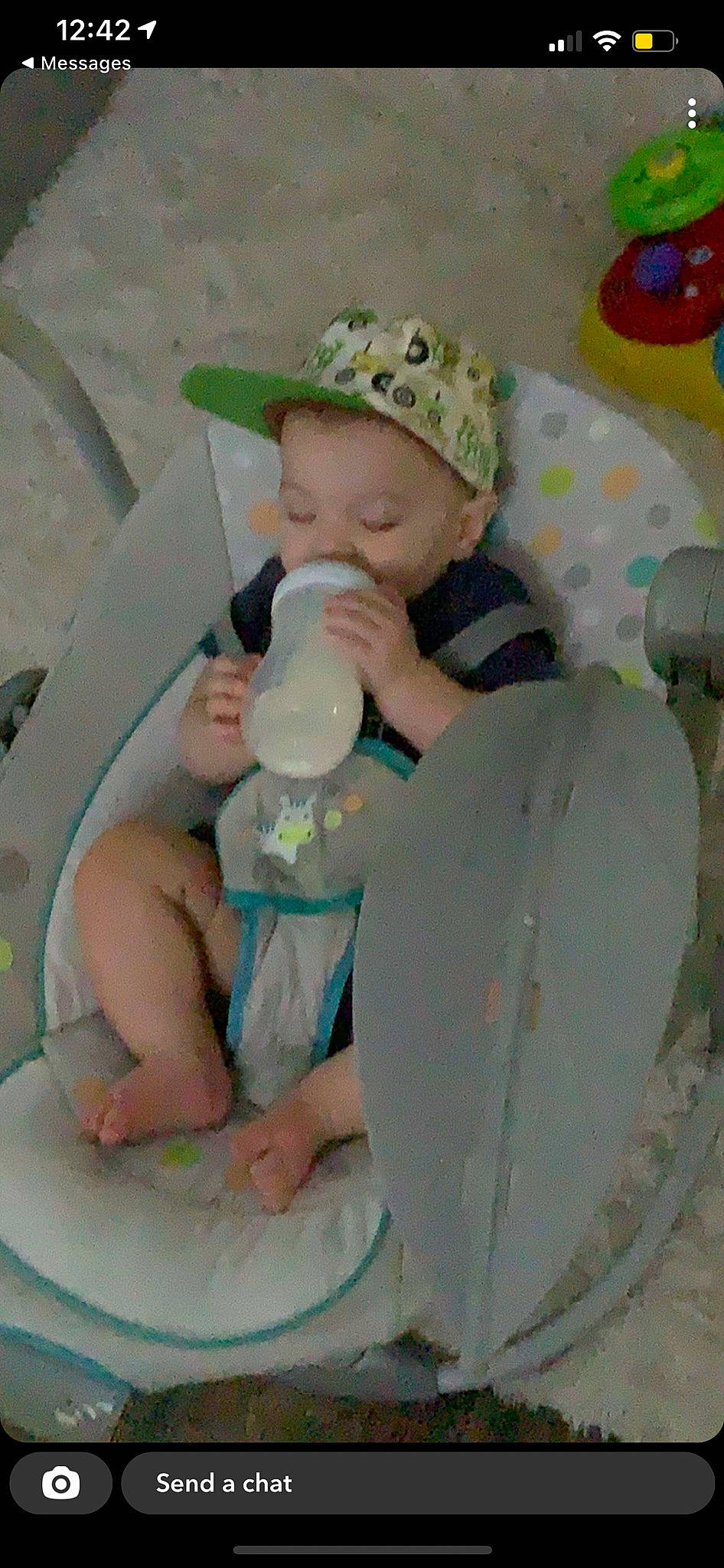 Brennan joined the competition — help win amazing prizes! baby, baby_products, baby_toddler_clothing, baby_toys, baseball_cap, cap, child, comfort, diaper, face, fun, hand, hat, human_body, leisure, person, plastic_bottle, room, sitting, skin