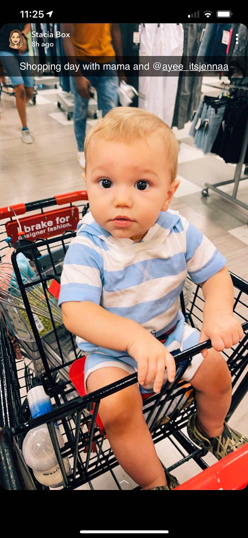 Brennan is registered to the contest to win money with this photo: baby_toddler_clothing, cheek, child, electric_blue, flooring, fun, human_leg, iris, joint, knee, lap, leisure, person, product, shopping_cart, sitting, skin, standing, surprise, thigh