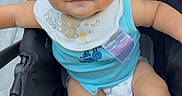 Giovanni joined the competition — help win amazing prizes! baby, baby_gear, bib, child, closeup, curly_hair, cute, diaper, eyes, face, infant, outdoor, pacifier_clip, photography, portrait, serious_expression, sitting, smiling, stroller, turquoise_clothing