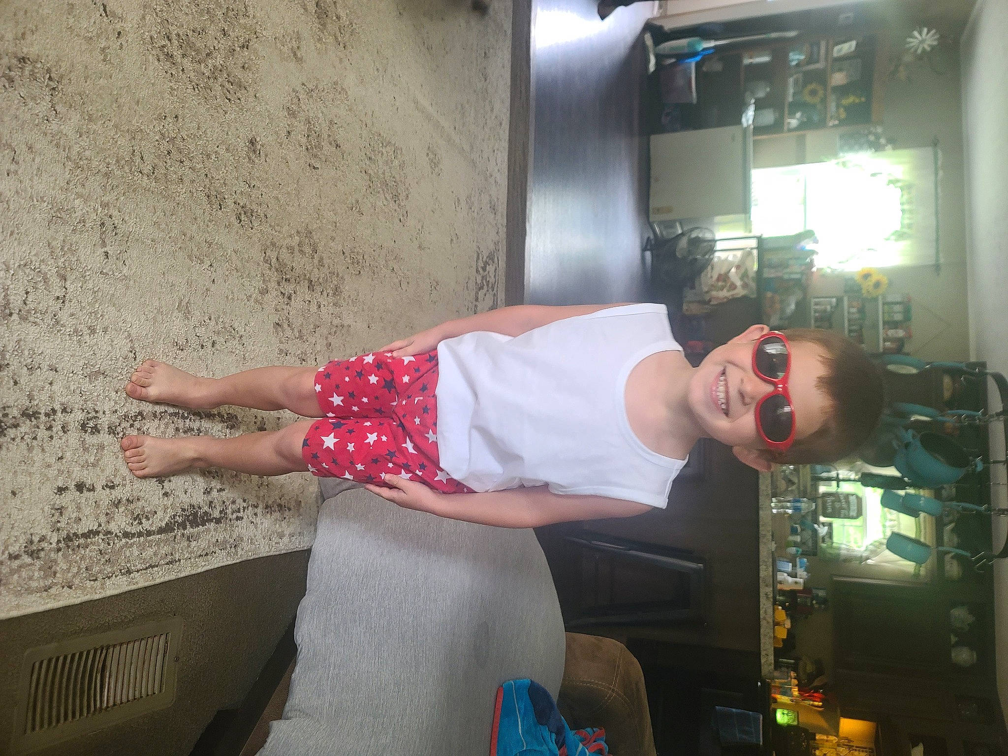 Daxton is registered to the contest to win money with this photo: concrete, elbow, fun, human_leg, joy, knee, machine, pattern, person, room, shorts, shoulder, sitting, thigh, vacation, waist, wrist