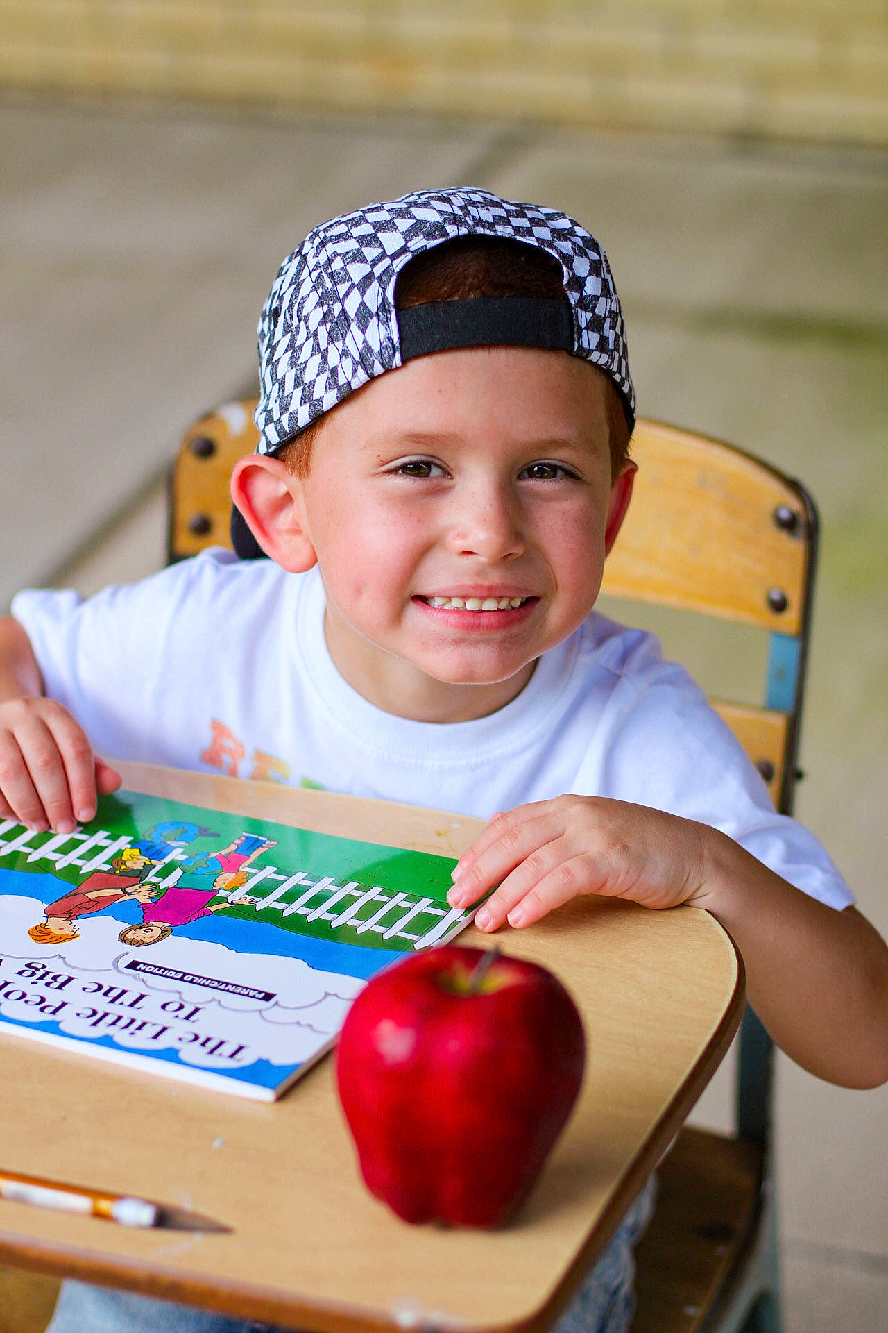 Daxton joined the competition — help win amazing prizes! cap, chair, child, event, food, fruit, fun, happy, headwear, joy, leisure, local_food, natural_foods, person, plant, produce, recreation, smile, superfood, table