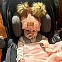 baby, car_seat, pacifier, pink_blanket, pink_hat, pom_poms, infant, child, clothing, warm, cozy, cute, indoors, seat_belt, portrait, face, hand, newborn, baby_clothes, soft