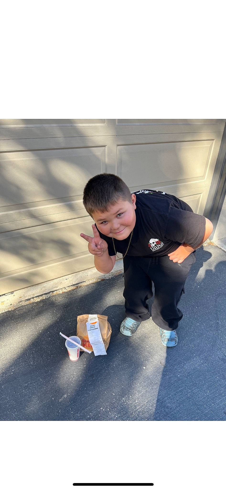 Junior joined the competition — help win amazing prizes! asphalt, city, concrete, electric_blue, flooring, fun, happy, jacket, joy, leisure, person, play, recreation, road, road_surface, rolling, shadow, sidewalk, sitting, sleeve