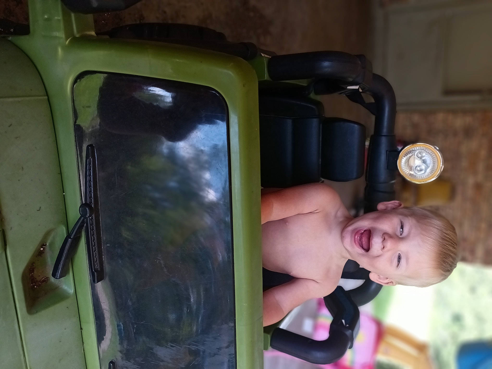 Remington is registered to the contest to win money with this photo: auto_part, automotive_exterior, automotive_lighting, automotive_window_part, baby, baby_products, baby_toddler_clothing, cameras_optics, chest, child, flash_photography, fun, gas, glass, happy, motor_vehicle, person, room, toddler, vehicle_door