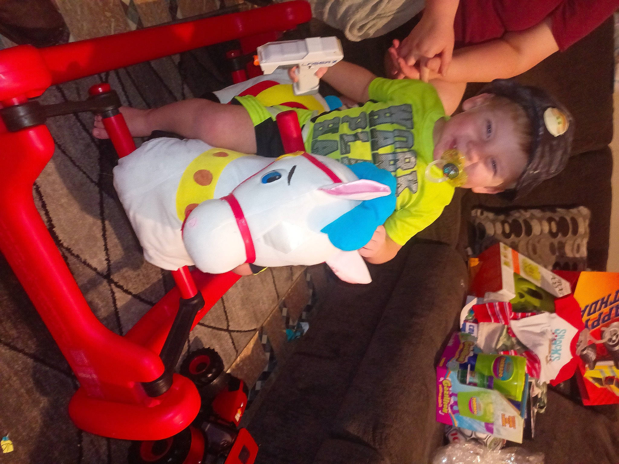 Remington is registered to the contest to win money with this photo: baby, baby_products, baby_toys, carmine, chair, child, event, fun, happy, joy, lap, person, plastic, play, product, room, smile, snapshot, t_shirt, thigh