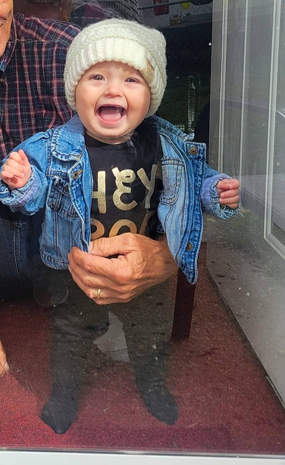 Rylee joined the competition — help win amazing prizes! baby, baby_toddler_clothing, cap, child, eye, flash_photography, fun, fur, gesture, glove, happy, headgear, headwear, human_body, knit_cap, mouth, person, sleeve, smile, thumb