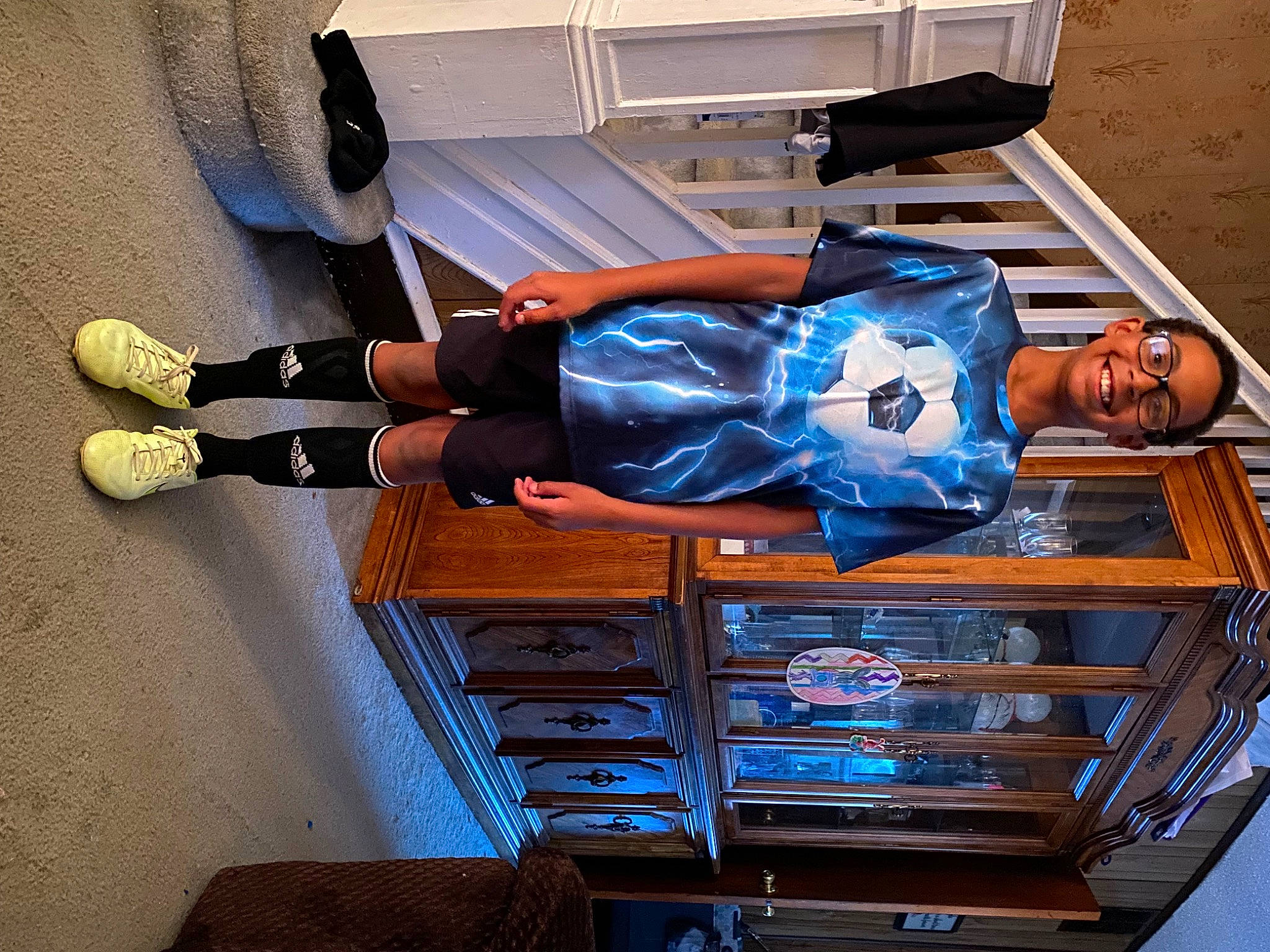 Lance joined the competition — help win amazing prizes! automotive_design, electric_blue, fun, hat, human_leg, joy, knee, person, recreation, room, smile, sneakers, sportswear, t_shirt, thigh, walking_shoe