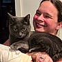 animal, arm, bond, casual, cat, closeup, cozy, domestic, face, furniture, gray_cat, happy, holding, indoor, person, pet, portrait, ring, smiling, woman