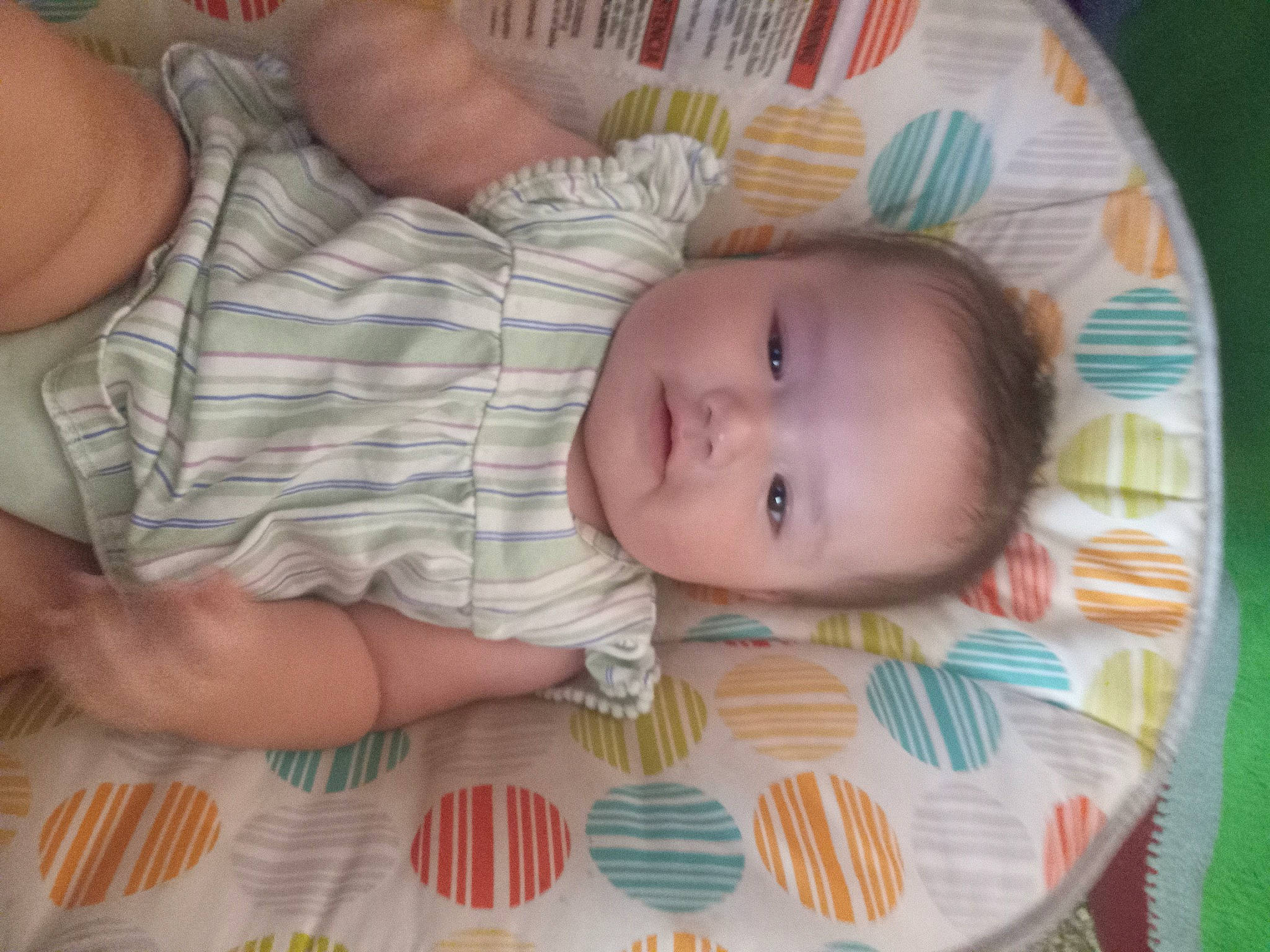 Kyrie is registered to the contest to win money with this photo: baby, baby_products, baby_toddler_clothing, bedtime, cheek, child, comfort, eyelash, head, iris, linens, nail, pattern, person, room, skin, smile, textile, thumb, toddler