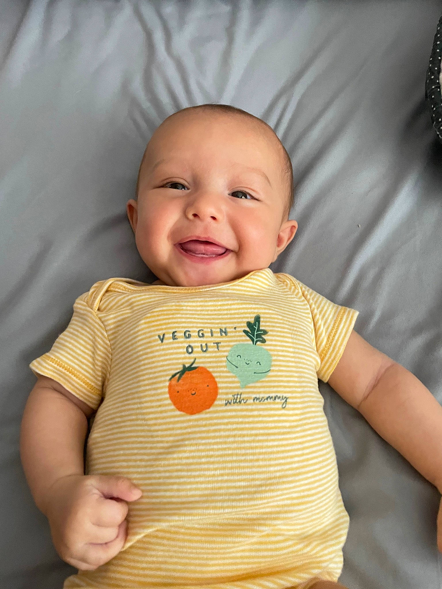Jewelena is registered to the contest to win money with this photo: arm, baby, baby_toddler_clothing, cheek, chin, facial_expression, finger, hand, happy, mammal, mouth, neck, nose, outerwear, person, product, skin, sleeve, smile, standing