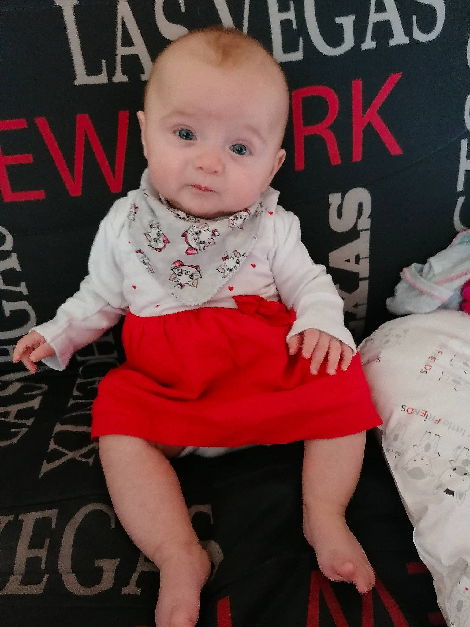 Ivanna participe au concours pour gagner de l'argent avec cette photo : baby, baby_products, cheek, child, child_model, dress, face, finger, flooring, head, lip, person, photography, product, red, sitting, skin, sleeve, toddler