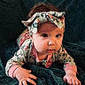 Edith joined the competition — help win amazing prizes! baby, infant, child, headband, floral_pattern, long_sleeves, hand, face, eyes, cheeks, blanket, texture, curious, lying_down, portrait, indoors, soft_lighting, closeup, cute, exploring