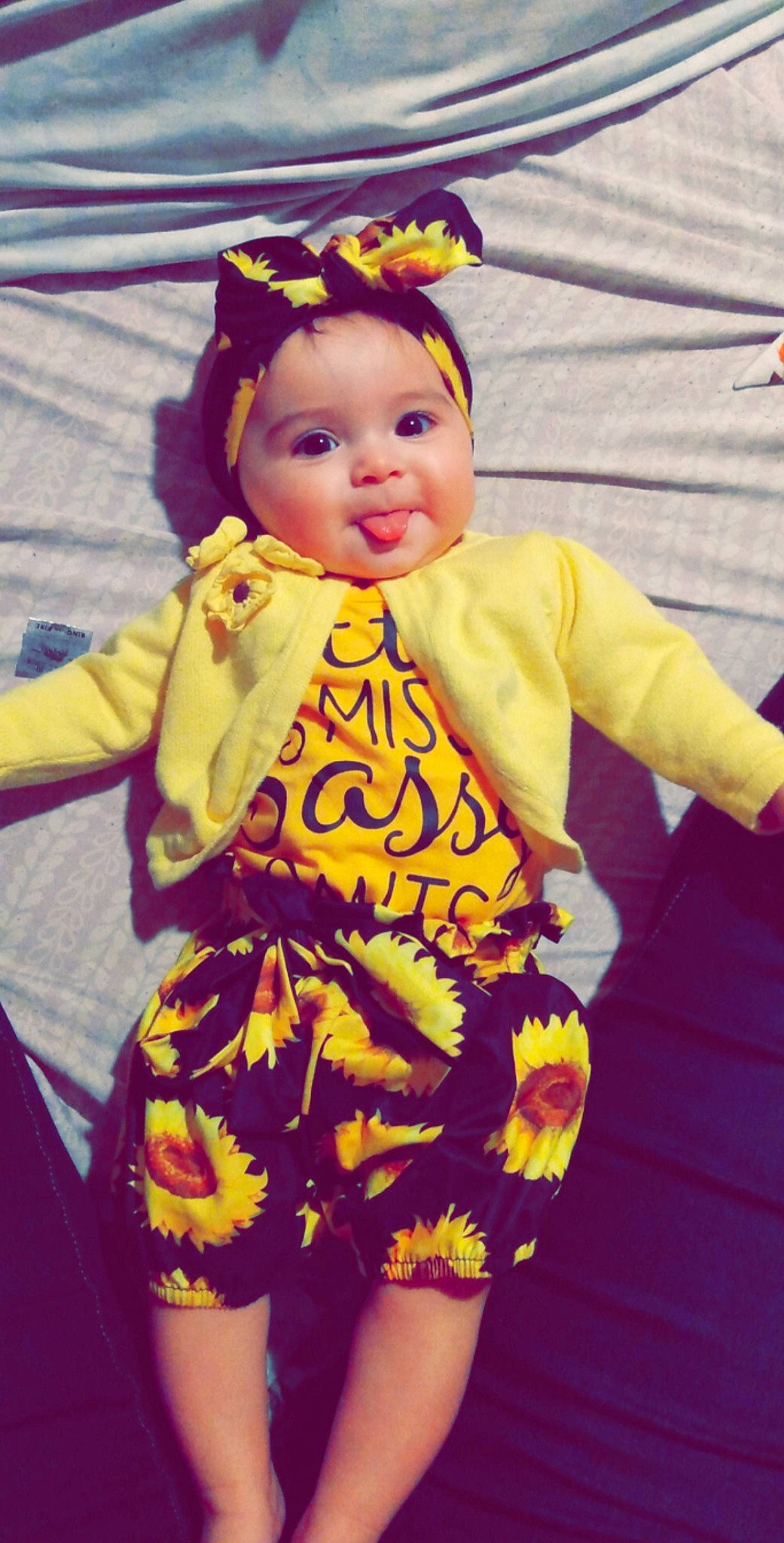 Mavis is registered to the contest to win money with this photo: baby, baby_products, baby_toddler_clothing, dress, entertainment, event, face, fashion_design, fun, happy, headwear, human_body, magenta, orange, outerwear, performing_arts, person, pink, sleeve, toddler